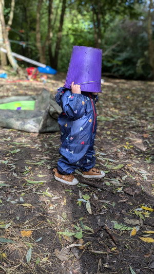 24 09 27 Nature Tots toddler with bucket on head